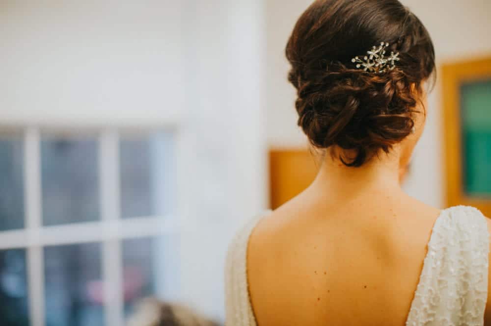 close up of bridal updo with hair accessory