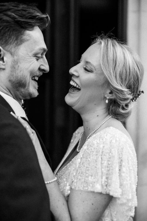vintage bride and groom laughing