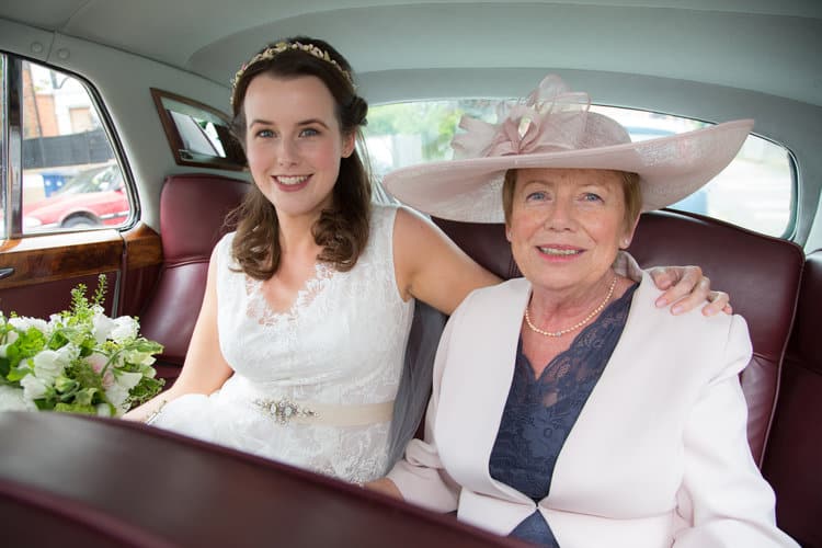 bride and mother of the bride in wedding car
