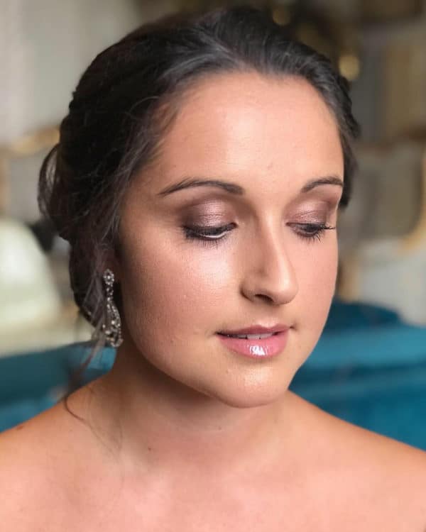 bride with purple eyeshadow by wedding hair and makeup artist Chloe