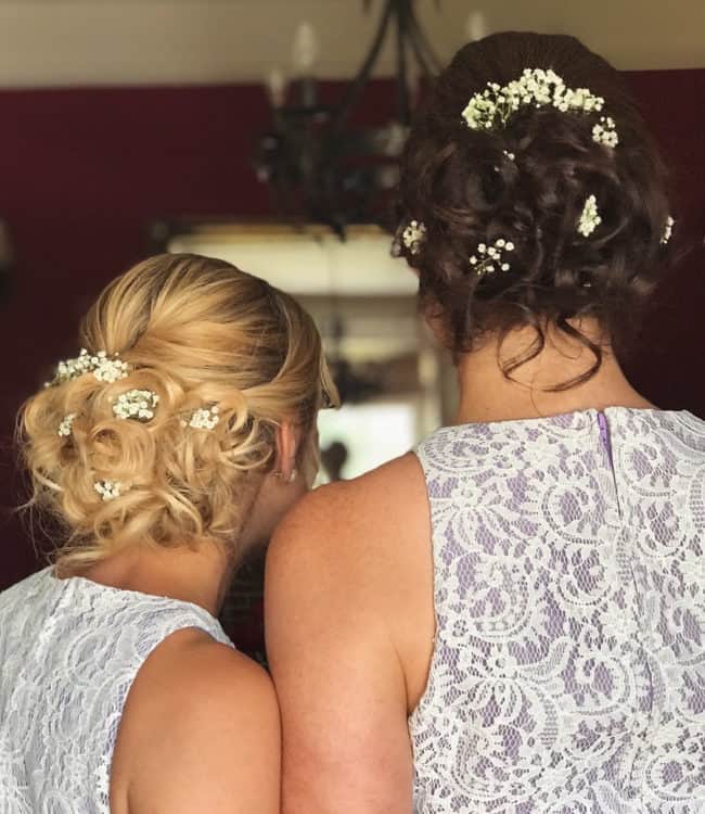 bridesmaid hair updo with flowers by wedding hair and makeup artist chloe