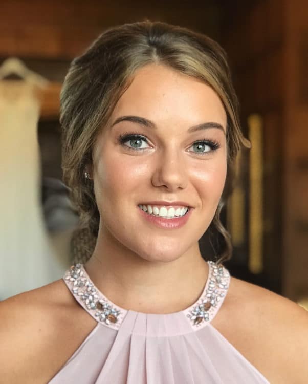 portrait of bridesmaid with natural hair and makeup